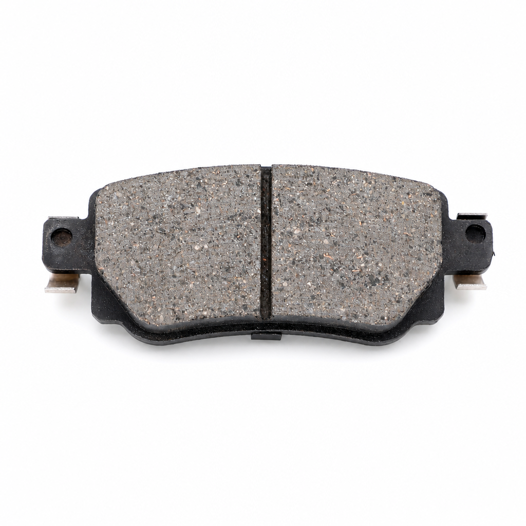 Disc brake pad samples showing friction material and steel backplate